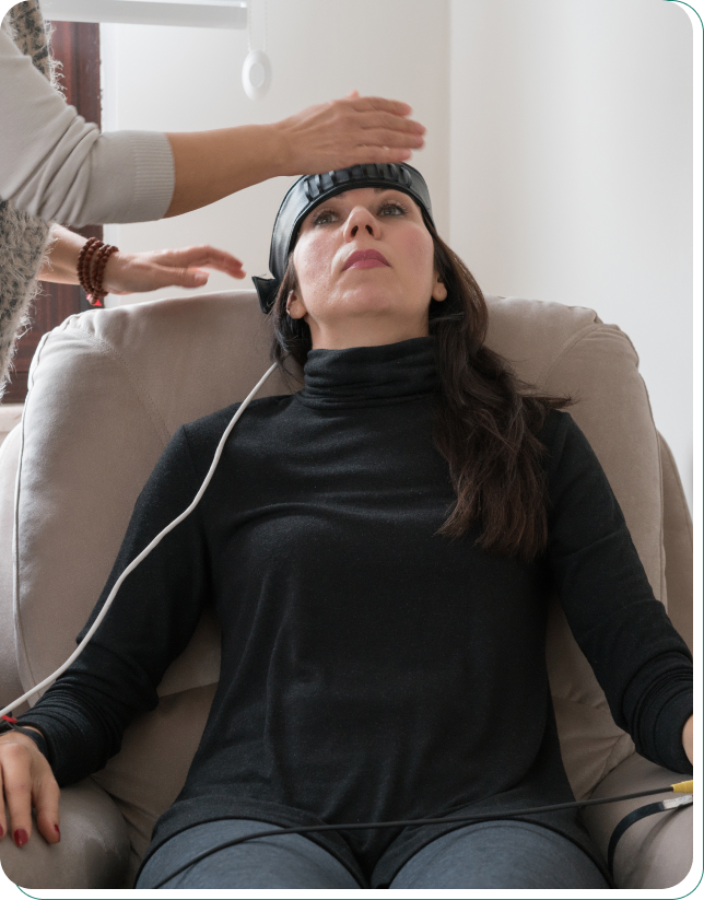 Group 1321316617 Woman receiving brain stimulation therapy session.