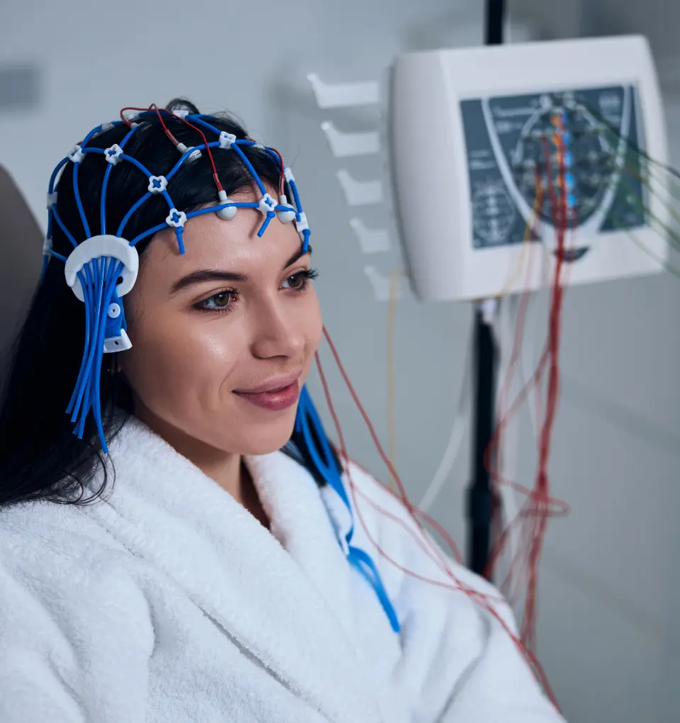 New Project(13) Woman undergoing brainwave monitoring in clinic.