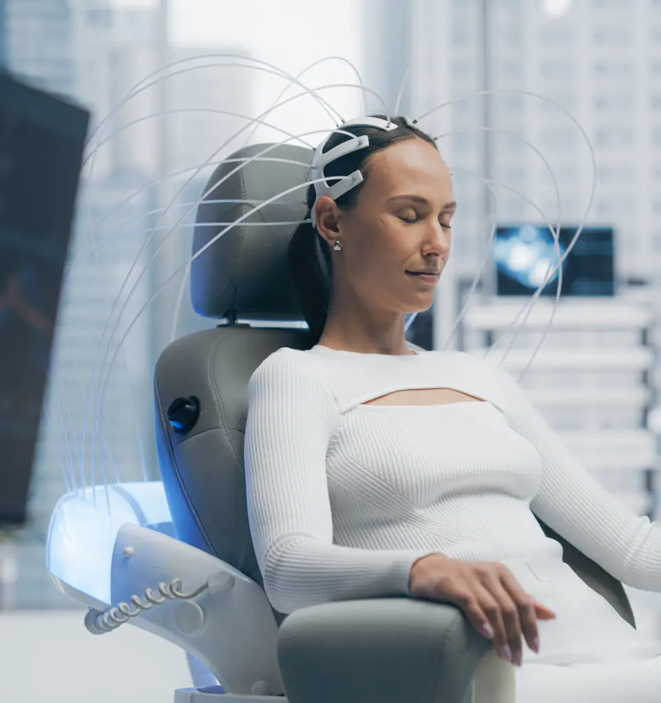 New Project(14) Person in futuristic chair with headgear.