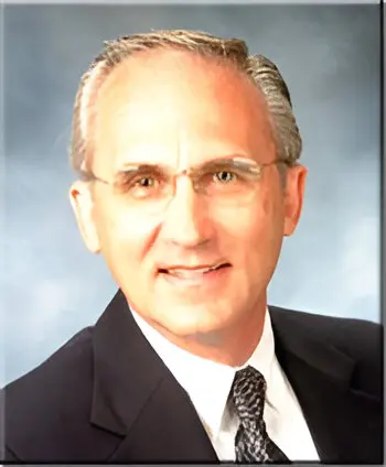 jkowal (1) Man in suit with glasses and tie.